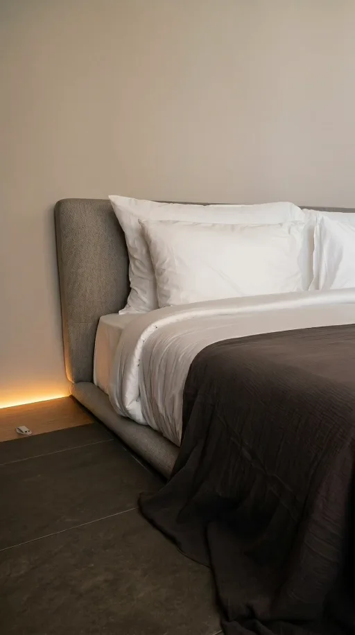 AI-created hotel room reel: a softly lit bedroom with neutral bedding.
